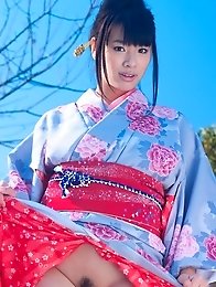 Asian big breasted Hana Haruna posing in a traditional japanese dress her huge tits!