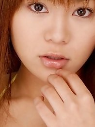 Av idol Yoko Matsugane posing in yellow bikini