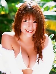Busty gravure idol babe Mai Nishida looks delicious in her white bikini